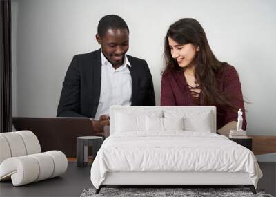 Multiethnic Colleagues Use Cellphones and Try Smartphone Applications In Office Wall mural