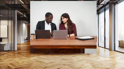 Multiethnic Colleagues Use Cellphones and Try Smartphone Applications In Office Wall mural