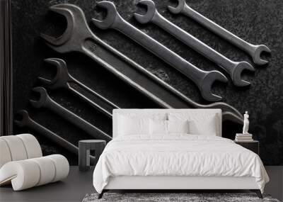 Set of different wrenches on a black background. Wall mural