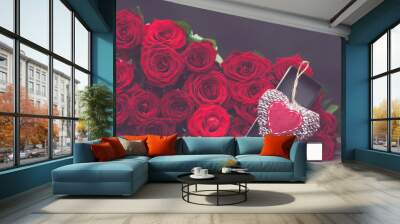  Concept of a gift for Valentine's Day.  large bunch of red roses and an open box with a stylish, knitted heart Wall mural