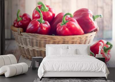 Basket with juicy red bell pepper on natural rustic background Wall mural