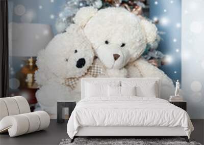 Christmas mood, Two white toy teddy bears  against the background of a white decorated Christmas tree. Waiting for a miracle, New Year decorations Wall mural