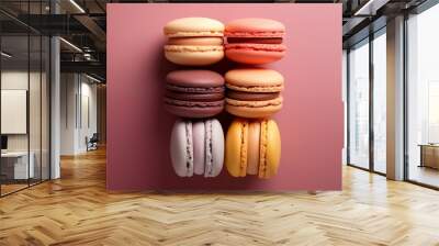 6 macarons of pink, yellow, white, mauve colour on pink background Wall mural