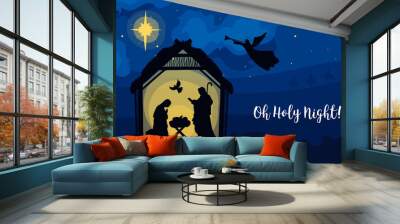 Greeting card of Traditional Christian Christmas Nativity Scene of baby Jesus in the manger with Mary and Joseph in silhouette. Holy Night Wall mural