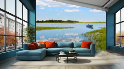 Tranquil view Niantic Connecticut salt marsh in summer with blue sky and blue boat reflections of cumulus clouds in still water with copy space, saltwater tidal marsh, East Lyme, New England scenic Wall mural