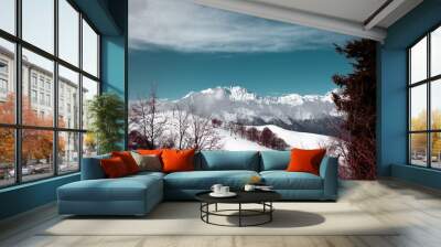 Monte rosa mountain, low clouds, blue sky. Suggestive view of Monte Rosa massif (the second highest mountain in the Alps) from Mottarone mountain. Piedmont - Italy. Wall mural