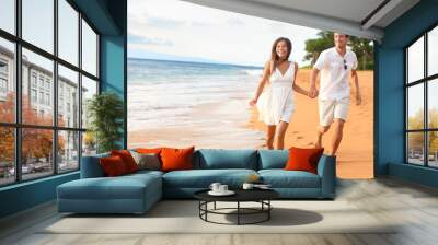 Beach couple on romantic travel honeymoon fun Wall mural