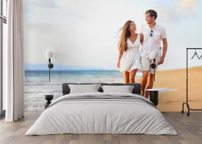 Beach couple walking on romantic travel Wall mural