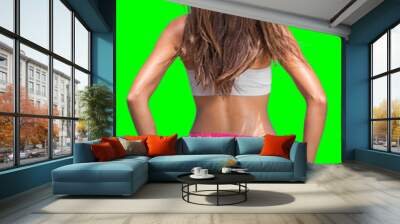 Beautiful fitness model isolated on green chroma background with fit body confident. Sportswear weight loss happy body active lifestyle concept. Summer living woman. Wall mural