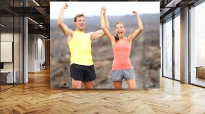 cheering celebrating happy fitness runner couple Wall mural