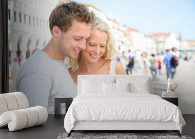 Couple on travel using tablet computer in Venice Wall mural