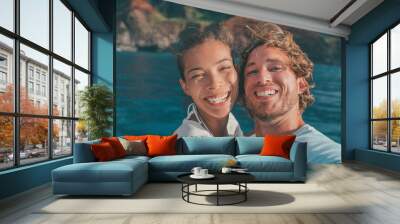 Cruise vacation happy tourists selfie smiling with perfect smile on outdoor nature adventure in ocean. Interracial couple Asian woman, Caucasian man. Wall mural