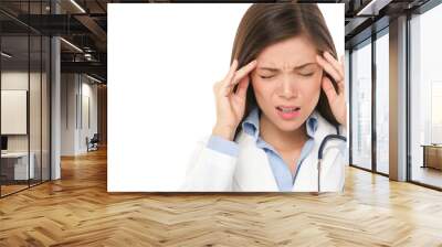 Doctor with headache stressed. Nurse / doctor with migraine headache overworked and stressed. Health care professional in lab coat wearing stethoscope isolated on white background.
 Wall mural