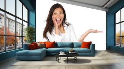 Excited woman showing product Wall mural