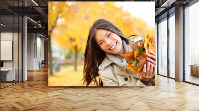 Fall woman playing with leaves Wall mural