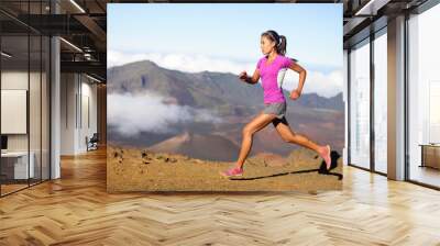 female running athlete - woman trail runner Wall mural