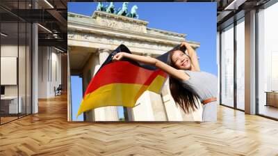 german flag woman happy at berlin brandenburg gate Wall mural