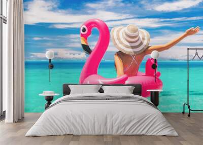 Happy summer vacation fun woman tourist enjoying travel holidays on beach banner background ready for swimming pool with flamingo float - funny holiday concept. Wall mural