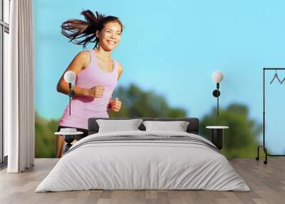 Happy woman running Wall mural