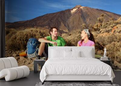 Happy Young Couple Hiking Wall mural