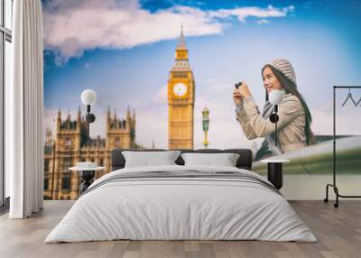 London europe travel woman taking pictures with phone. Mobile photography. Tourist holding smartphone camera taking photos at Big Ben, Westminster Bridge, London, England. British people. Wall mural