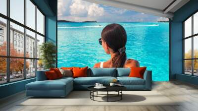 Luxury beach ocean vacation elegant lady walking over pristine turquoise ocean crystalline water in paradise honeymoon travel destination panoramic banner. Cruise background tourist woman. Wall mural