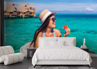 Luxury resort vacation woman eating fruits detox breakfast on beach hotel room with private terrace. Tourist girl healthy diet lifestyle. Wall mural