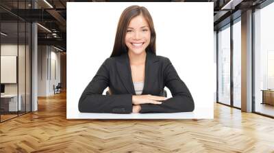 Multiethnic businesswoman sitting at desk smiling Wall mural