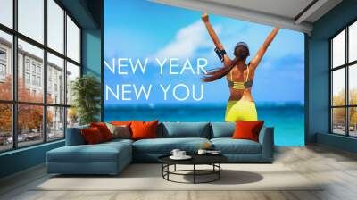 New Year New You motivational message weight loss fitness banner. New Year new you resolution inspirational quote on beach background. Cheering winner woman with arms up training goal. Wall mural