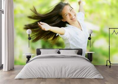 Rejoicing happy woman in flying motion Wall mural