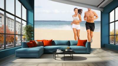 runners - young couple running on beach Wall mural