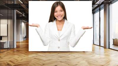 Showing business woman with open hand palms for copy space for two products. Businesswoman in white suit isolated cutout PNG on transparent background. Happy Chinese Asian / Caucasian female model. Wall mural