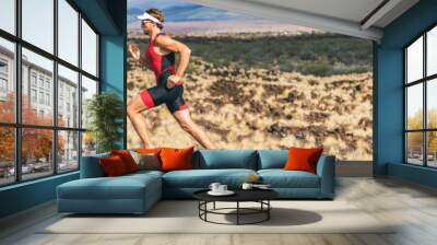 Triathlon runner triathlete man running in tri suit at ironman competition race. Panorama banner. Sport athlete on marathon run training in professional tri outfit for triathlon. Fitness in Hawaii. Wall mural