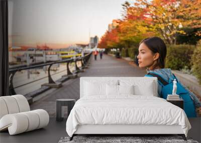 Vancouver city urban lifestyle people at Harbour, British Columbia. Woman tourist with student backpack in city outdoors enjoying autumn season. Wall mural