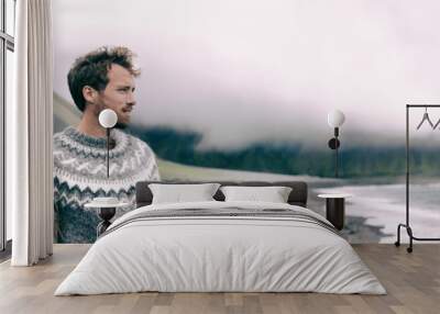 Winter nature panoramic people couple wearing icelandic wool handknit knitted pullover sweaters on outdoor beach banner. Fashion models background. Wall mural