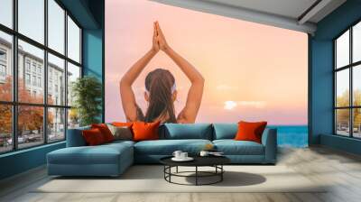 Yoga meditation woman meditating at beach sunset relaxing in yoga tree pose doing sun salutation. Relaxing serene woman enjoying sunshine banner panorama Wall mural