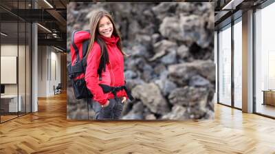 young smiling woman hiking Wall mural