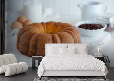 bundt cake and ingredients on a table Wall mural