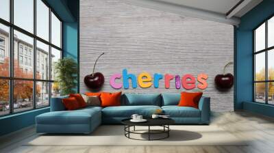 Two cherries with the word cherries Wall mural