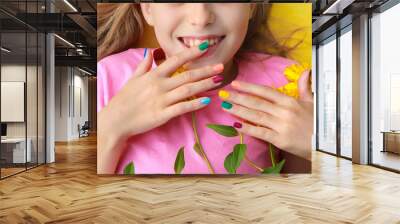 Bright and colorful children's manicure on the nails of girls with yellow flowers and good mood. Wall mural