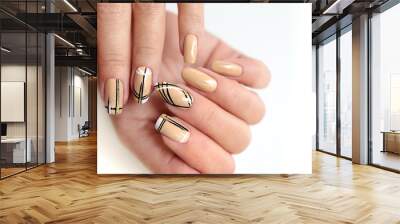 Manicure on different nail shapes with black lines on beige nail Polish with sequins. Wall mural