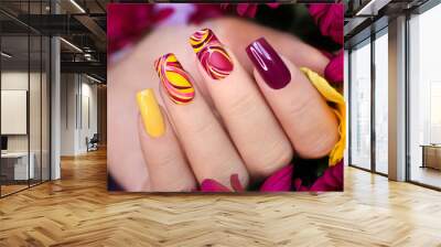 Nail design on shiny and matte nail Polish with smooth curves.Fashionable multicolored manicure. Wall mural