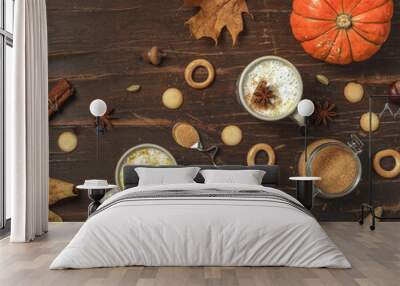 Autumn concept in vintage style. Two cups of cappuccino, brown sugar, cookies, and dried maple leaves on a rough, dark wooden table. Top view with space Wall mural