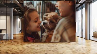 A heartwarming moment in an animal shelter, where two smiling girls share a tender interaction with a small, fluffy dog, highlighting the joy of companionship and pet adoption AI Wall mural