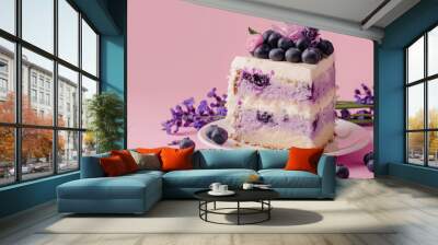 A slice of blueberry and lavender cheesecake cake on pink background with copy space. Wall mural