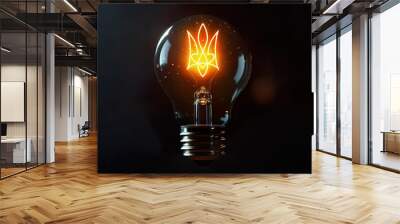 Light bulb on a dark background and graphic image of Ukrainian Trident. Concept of problems with electricity in Ukraine, saving light, power outages. Wall mural