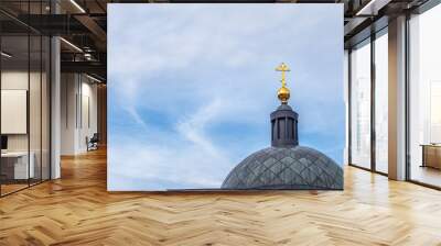 orthodox chapel dome with a gilded cross against cloudy sky Wall mural