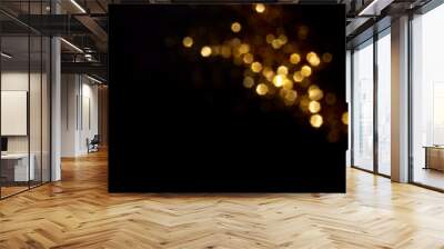 Golden blurred bokeh lights on black background. Glitter sparkle stars for celebrate. Overlay for your design Wall mural