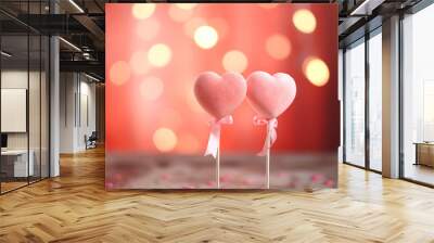 Two pink hearts with bows on sticks against background with lights, sparkles and bokeh. Valentine's Day card Wall mural