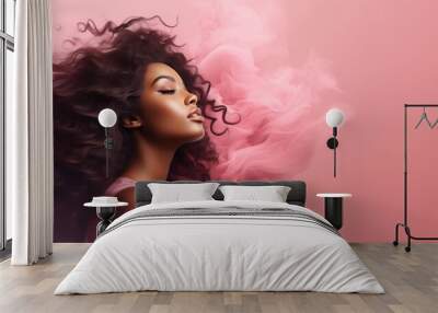 Beautiful african american woman with curly hair and smoke on pink background Wall mural